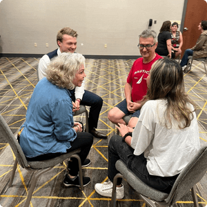 group-of-participants-engaging-in-mindset-mastery-exercises-learning-to-reprogram-their-thinking